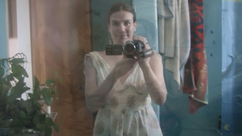 Alexandra Hidalgo films her reflection in A Family of Stories