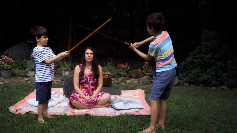 Santiago Hidalgo-Bowler and William Hidalgo-Bowler play swords as Alexandra Hidalgo watches in A Family of Stories